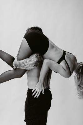 Carried over the shoulder, playful couples frame