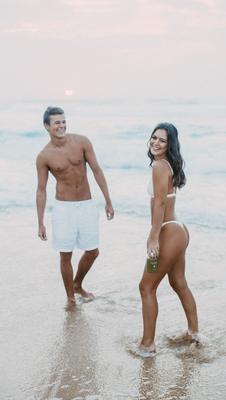 Walking the shoreline together, couples beach session