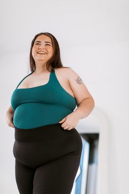 Green top and black leggings, studio portrait Newcastle