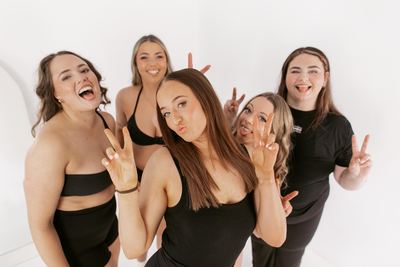 Five friends laughing together, group studio session Newcastle